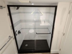Brand new full shower with glass doors installed
