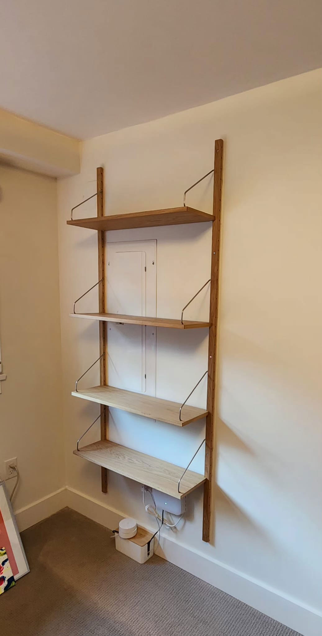 After shot of a hanging book shelf on a wall