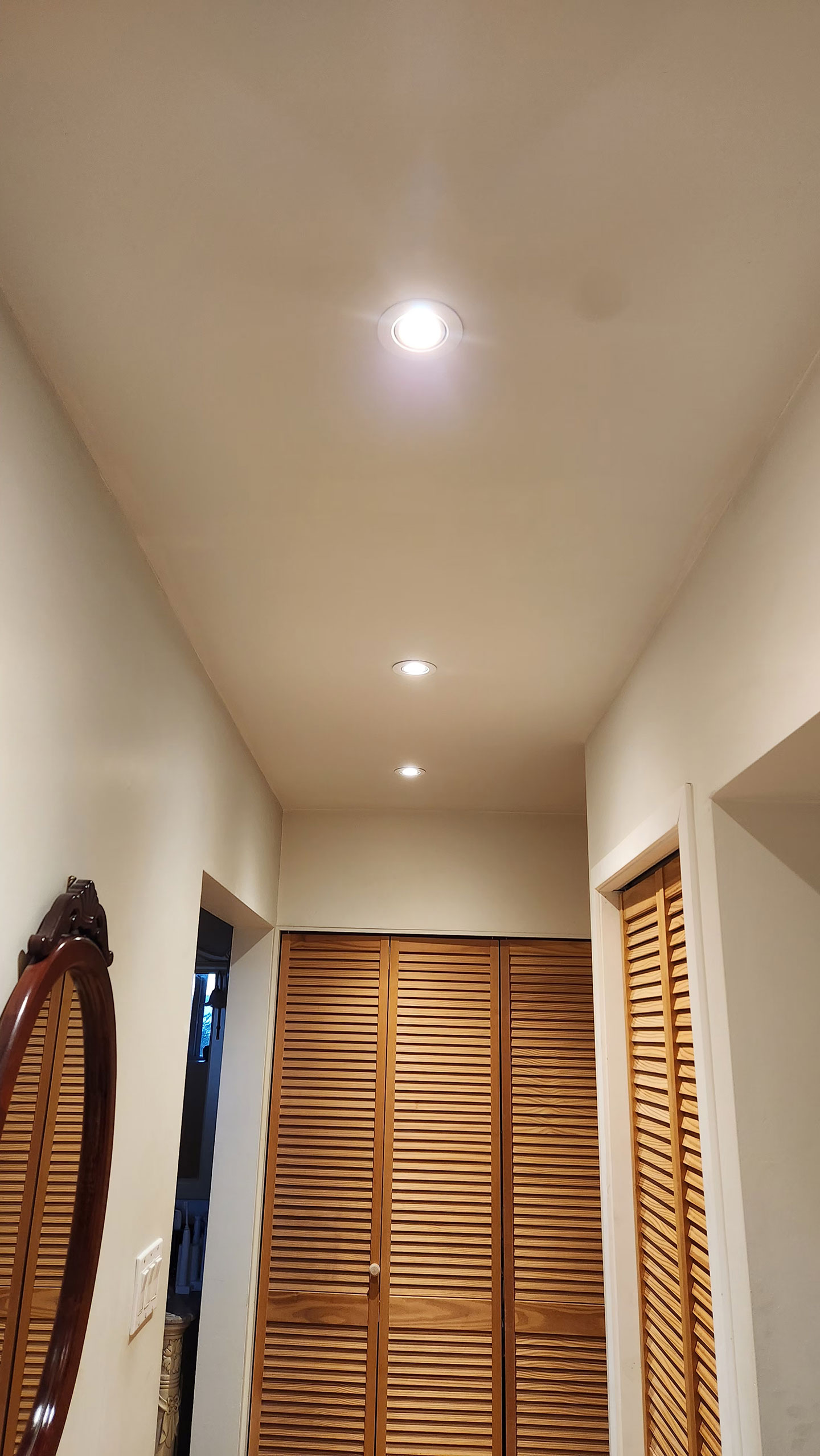 After shot of installed pot lights with a raised ceiling