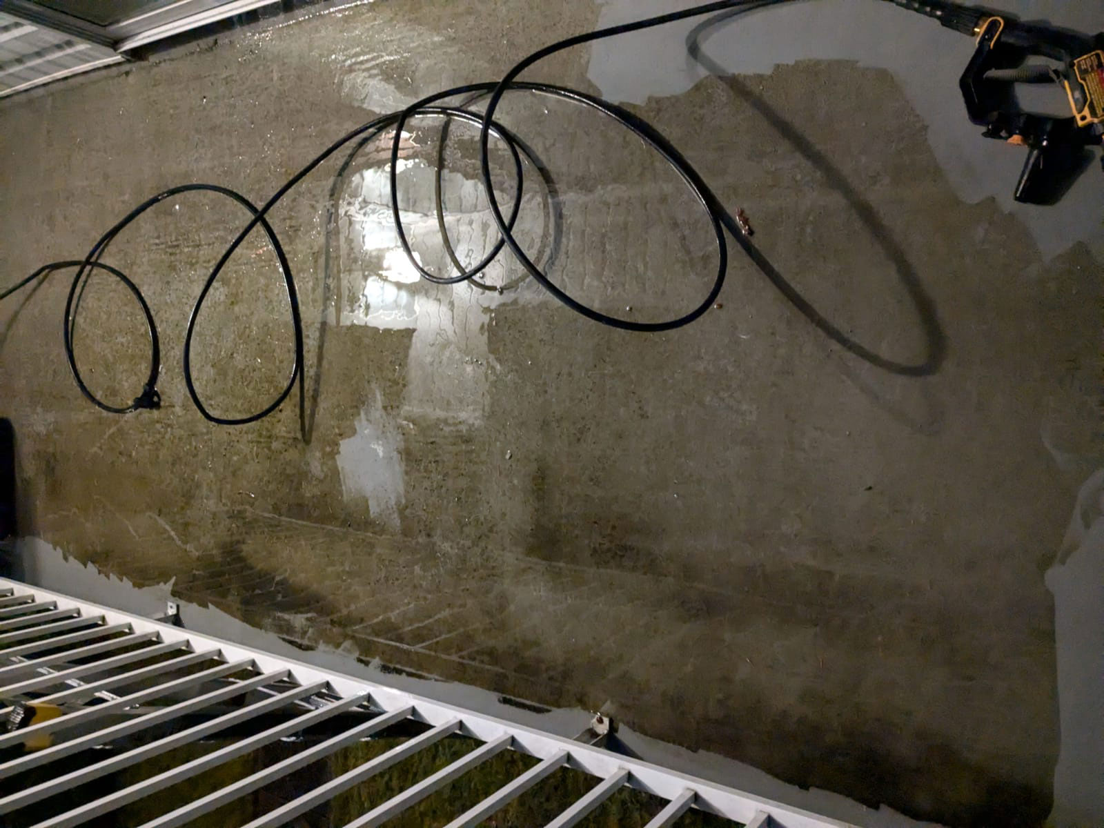 Before shot of a dirty, wet deck covered in mold and moss