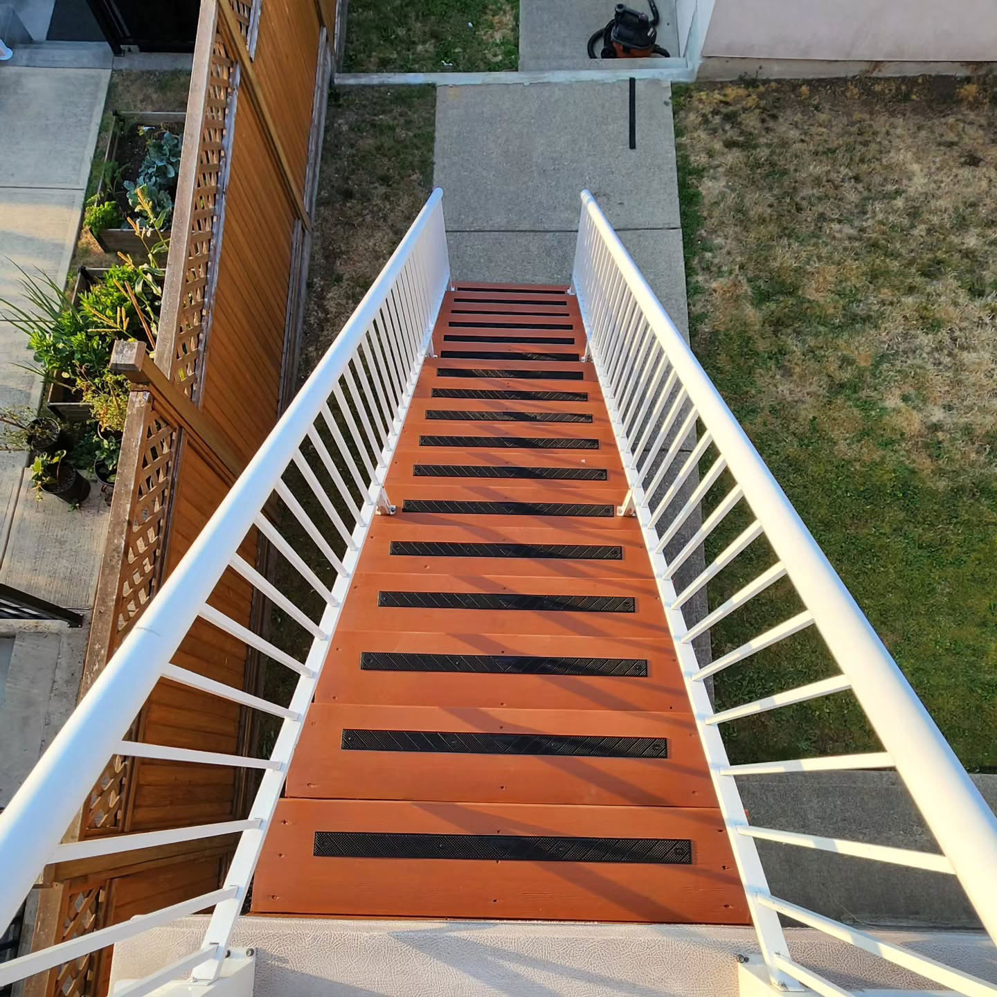 Painted and cleaned red stairs in the back yard looks like new