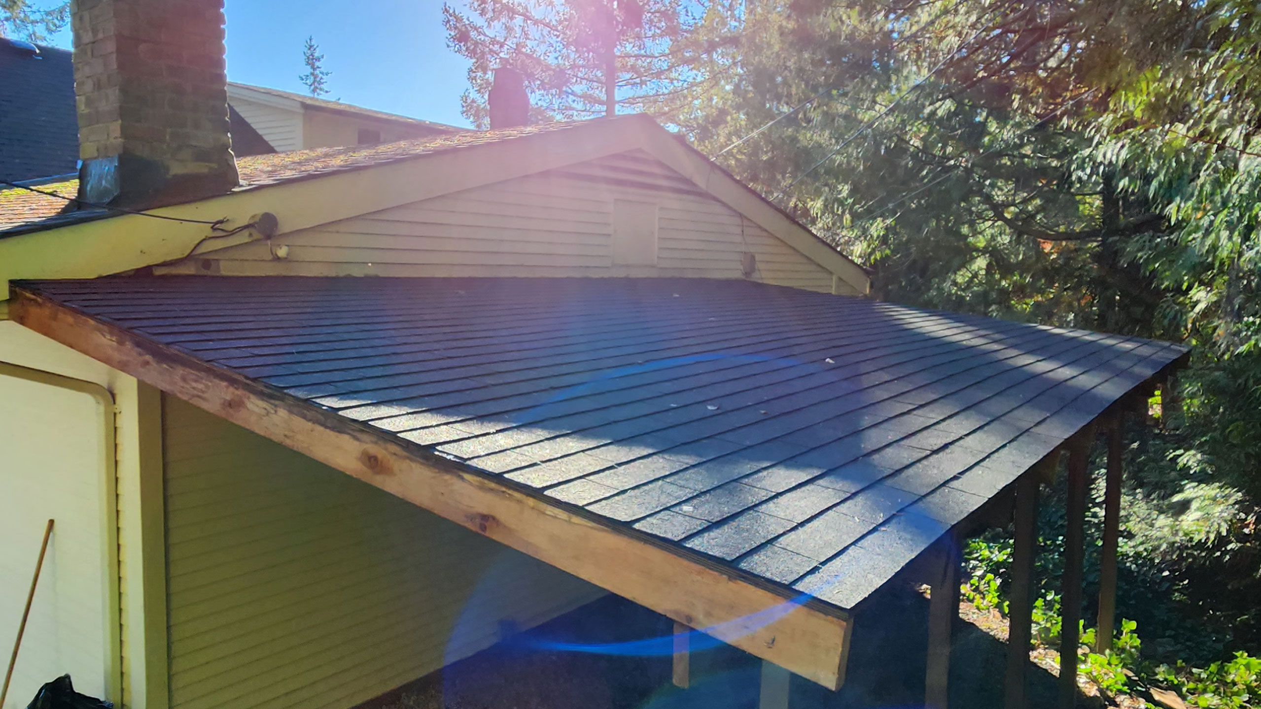 After shot of a new roof with roof shingles installed